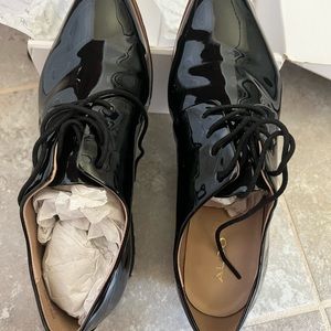 Almost brand new Aldo black patent leather size 9 shoes .